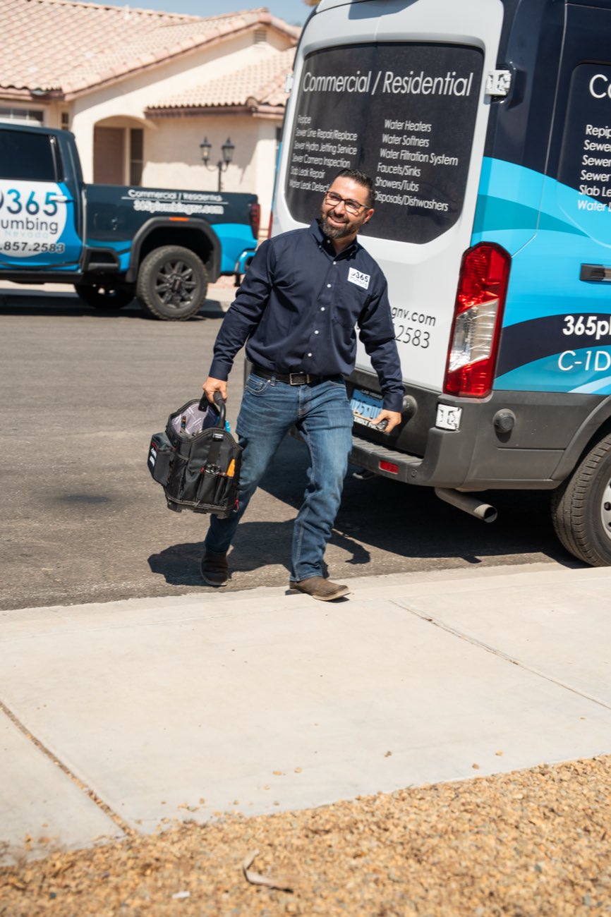 365 Plumbing technician arriving at a Las Vegas home with a tool bag
